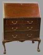 VINTAGE MAHOGANY FALL FRONT BUREAU with interior leather skiver, central cupboard door, drawers