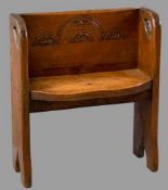 RUSTIC OAK HALL BENCH of neat proportions having carved detail to the back and shaped seat, 76cms H,