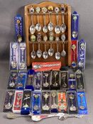 SOUVENIR SPOONS - a collection on a rack and cased, approximately thirty five