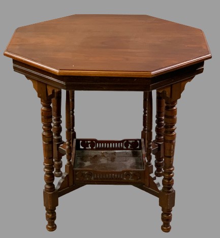 EDWARDIAN MAHOGANY OCTAGONAL TOP TABLE with lower galleried shelf, on multiple turned supports,