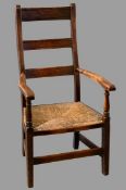 ANTIQUE ELM RUSH SEATED LADDERBACK FARMHOUSE ARMCHAIR, 108cms H, 56cms W, 44cms D the seat