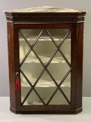 ANTIQUE OAK WALL HANGING CORNER CUPBOARD with twelve pane astragal glazed single door and shaped