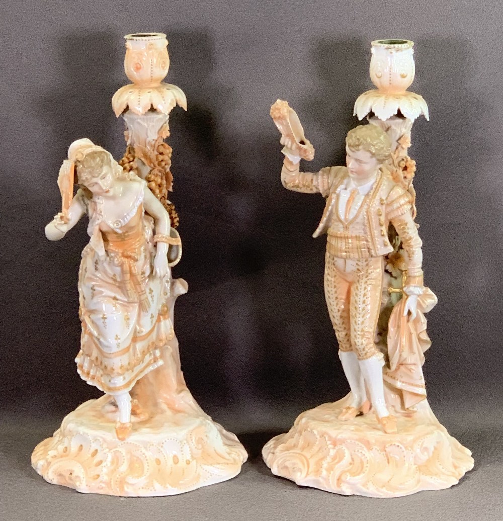 CONTINENTAL CHINA CANDLEHOLDERS, a pair, young girl and a matador, 34cms H and an amber glass and
