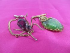 ANTIQUE SPIDER BROOCH with amethyst coloured stone body and honeybee safety chain, together with a