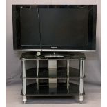 PANASONIC VIERA 36IN FLATSCREEN TV WITH REMOTE CONTROL - on a black glass and chrome three tier