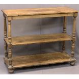 VICTORIAN MAHOGANY THREE-TIER DUMB WAITER on turned and block supports with bun feet and castors,