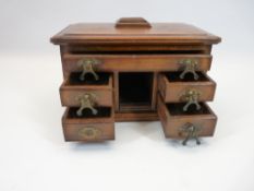 CIRCA 1900 MINIATURE PEDESTAL DESK INK STAND having a single long top drawer and twin pairs of lower