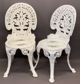 CAST ALUMINIUM GARDEN CHAIRS, A PAIR - with leaf detail to the backs, circular seats and splayed