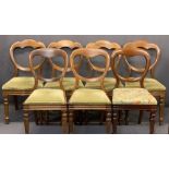 VICTORIAN MAHOGANY BALLOON BACK SALON CHAIRS (7 - 4+2+1) - the set of four having shaped crest