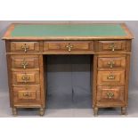 NEATLY PROPORTIONED TWIN PEDESTAL DESK - having inset green leatherette surface over three frieze