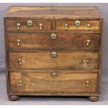ANTIQUE CROSSBANDED FRUIT WOOD CHEST - of two short over three long drawers with circular brass