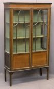 EDWARDIAN LINE INLAID MAHOGANY TWO DOOR CHINA DISPLAY CABINET - with interior fabric covered shelves