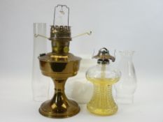 OIL LAMPS - a vintage glass based and a brass example (two chimneys, one shade)