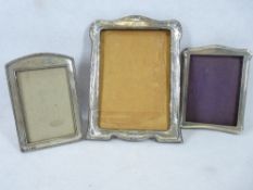 SILVER MOUNTED PORTRAIT FRAMES (3) - Birmingham hallmarks for 1924, 23 x 17cms, 1921 16 x 12cms