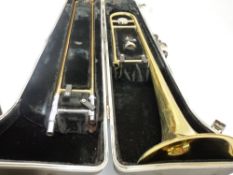 MUSICAL INSTRUMENTS - cased Bundy brass trombone
