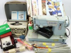 VINTAGE SINGER ELECTRIC SEWING MACHINE in carry case, a quantity of associated workbooks, Tippa