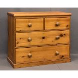 VICTORIAN PINE CHEST OF TWO SHORT OVER TWO LONG DRAWERS - with turned wooden knobs on a plinth base,