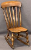 CIRCA 1880 FARMHOUSE ROCKING CHAIR - with curved and slatted back, on turned supports and stretcher,