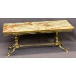 MID-CENTURY BRASS & ONYX COFFEE TABLE - the rectangular top over a galleried frieze, urn shape