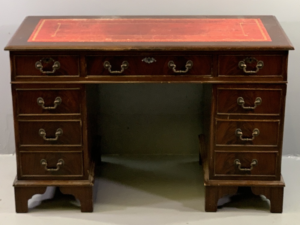 REPRODUCTION DESK with tooled red leather effect top, twin pedestals and a central drawer, 77cms