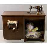 VINTAGE SEWING CABINET with Jones hand crank sewing machine and haberdashery contents, 80cms H,