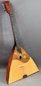 MUSICAL INSTRUMENTS - a balalaika with label 'The Ozark for Stentor Music Company', six strings,