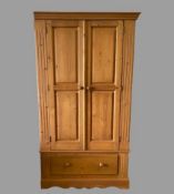 PINE WARDROBE - two door and a base drawer with turned knobs, 193cms H, 107cms W, 60cms D