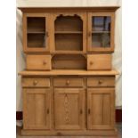 FARMHOUSE PINE TYPE DRESSER with upper glazed doors and central shelves over a three door and drawer
