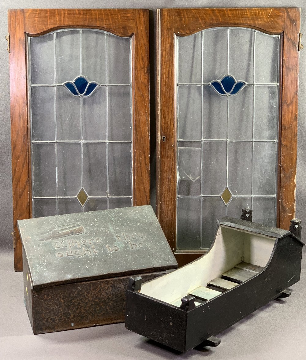 ANTIQUE WOODEN DOLL'S COT, beaten brass slipper box and a pair of leaded stained glass doors/panels,