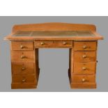 ANTIQUE PINE TWIN PEDESTAL DESK with tooled leather effect top, railback and a central drawer, 93cms