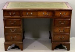 REPRODUCTION DESK with green leather effect tooled top, twin pedestals and central drawer, 79cms