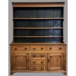 NORTH WALES DRESSER having a three shelf rack over a T-Bank of three over three drawers and two side