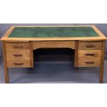MID-CENTURY TEAK OFFICE DESK - with inset green leather top, central frieze drawer, twin pull-out