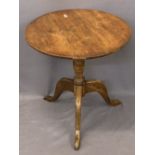 ANTIQUE OAK TILT TOP TABLE - 65cms diameter circular top on a turned column and three splayed