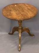 ANTIQUE OAK TILT TOP TABLE - 65cms diameter circular top on a turned column and three splayed