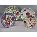 FOUR ANTIQUE SPONGEWARE CIRCULAR SHALLOW DISHES, colourfully floral decorated, two in the manner