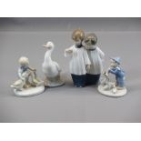 SPANISH OVAL BASED FIGURINES, A PAIR, a little boy with ducks and a little girl with ducks, a NAO