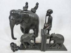 AFRICAN CARVED FIGURE OF A SEATED FIGURE - 27cms tall, a carved elephant with seated figures,