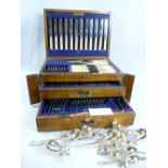 OAK CASED TABLE CANTEEN OF CUTLERY, one hundred piece, within a fitted lidded top and two drawers