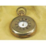 A DENNISON STAR ROLLED GOLD HALF HUNTER POCKET WATCH - with white enamel dial, Roman numerals and