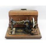 G H LEE & CO LTD LIVERPOOL 'The Lee' hand crank sewing machine in walnut case
