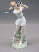 NAO POTTERY FIGURINE - a young girl golfer with club in hand