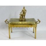 VINTAGE CAR MASCOT and a brass trivet stand having a pierced top and end carry handles, on tubular