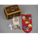 GIRL GUIDES BADGES - a collection in a pokerwork wooden box and a vintage pocket watch key