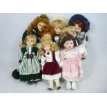 DOLLS - an assortment of various 20th century porcelain headed dolls with costumes