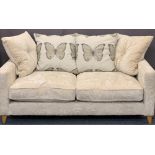 ULTRA MODERN TWO SEATER UPHOLSTERED SETTEE with butterfly detail to the fabric, 98cms H, 180cms W,