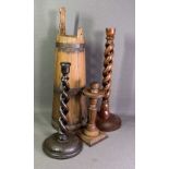 TREEN - twist candlesticks, 32cms the tallest, another carved candlestick and a conical shaped