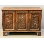 ANTIQUE CARVED OAK TWO DOOR SIDEBOARD (ex-coffer), the moulded edge top over a central panel and