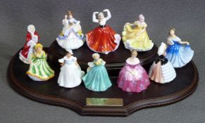 ROYAL DOULTON miniature figurines (10) on a wooden plinth