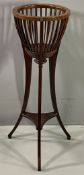 PLANTER STAND - antique mahogany with basket top and lion motifs, on curved tripod supports, 96cms